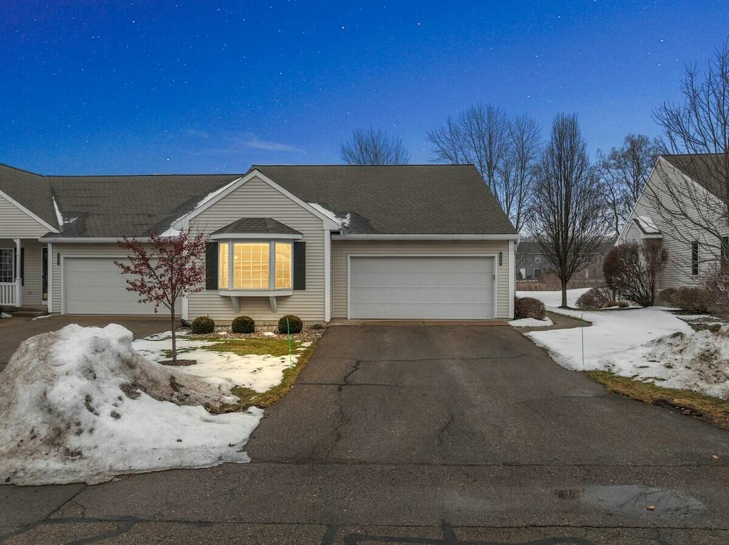 ranch-style home with a garage