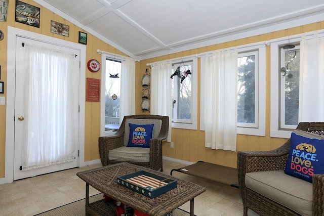 sitting room featuring plenty of natural light and vaulted ceiling