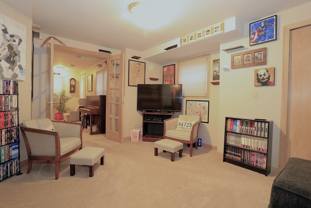 living area with light carpet