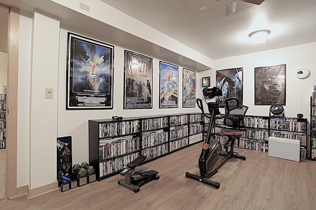 workout room with wood-type flooring and ceiling fan