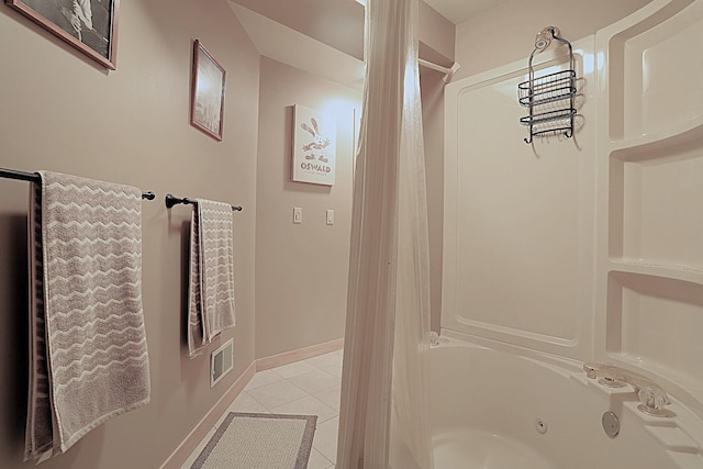 bathroom featuring tile patterned flooring and shower / bath combo with shower curtain