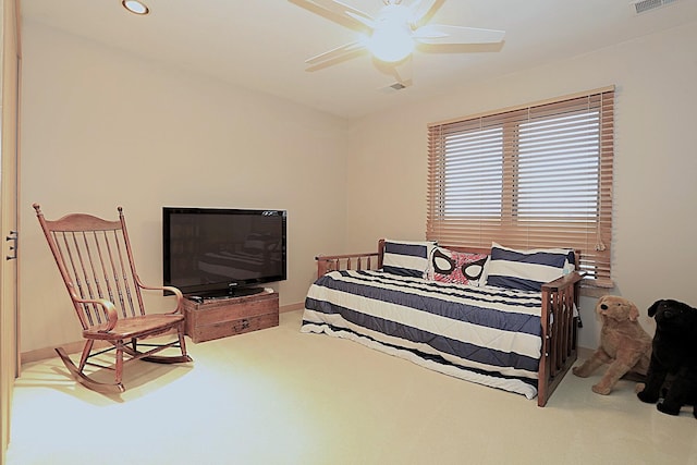 carpeted bedroom featuring ceiling fan