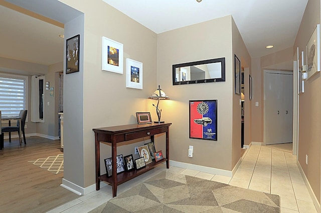 hall with light hardwood / wood-style floors