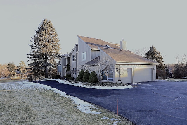 view of property exterior with a garage