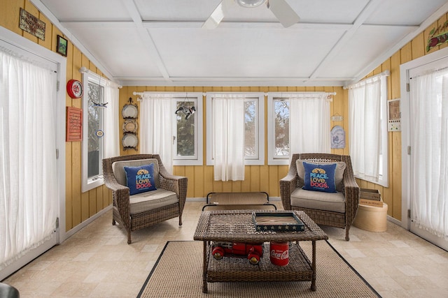 sunroom with coffered ceiling and ceiling fan