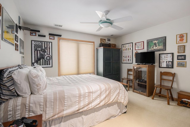 carpeted bedroom featuring ceiling fan