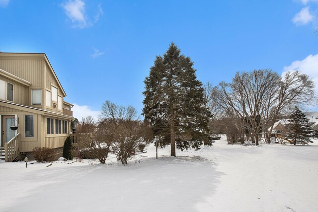 view of yard layered in snow