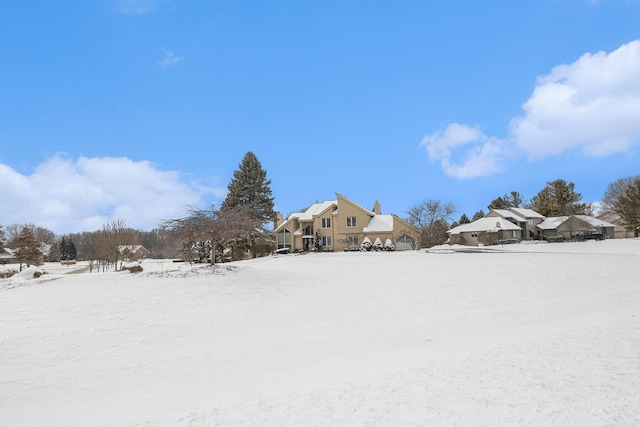 view of yard covered in snow