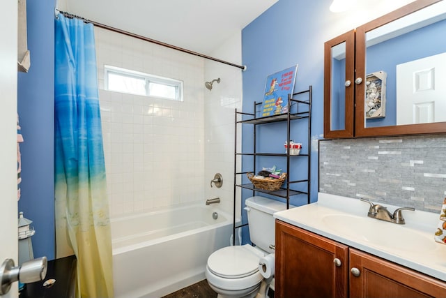 full bathroom with vanity, decorative backsplash, toilet, and shower / bath combo