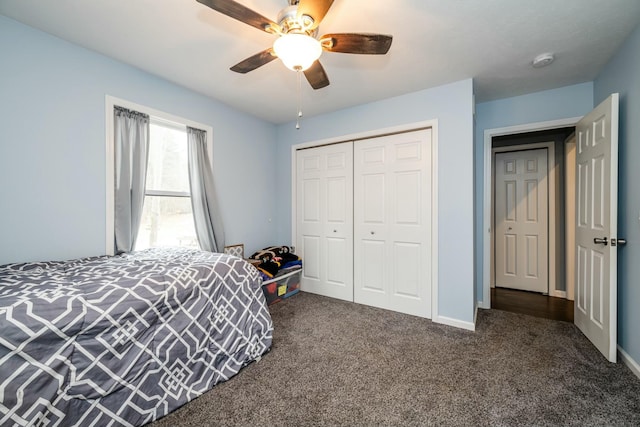 bedroom with a closet, ceiling fan, and dark colored carpet