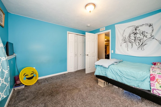 carpeted bedroom featuring a closet