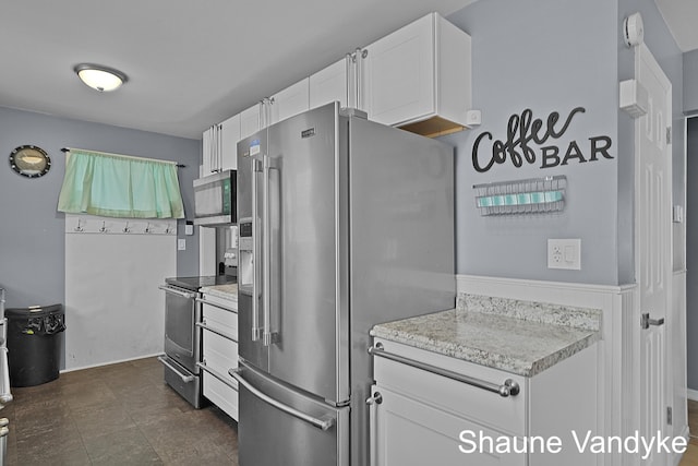 kitchen with stainless steel appliances and white cabinets