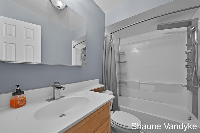 full bathroom featuring vanity, shower / bathtub combination with curtain, and toilet