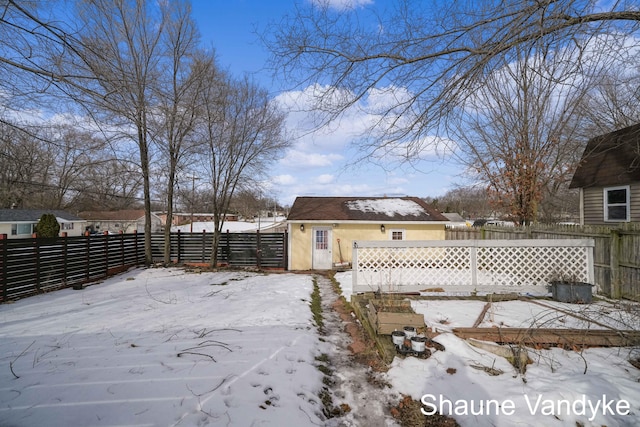 view of yard layered in snow