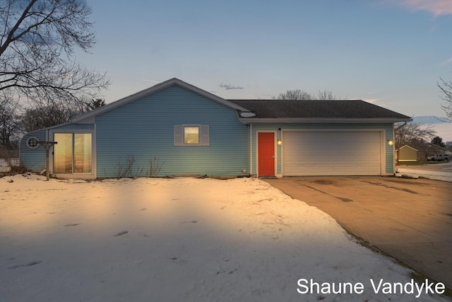 single story home featuring a garage