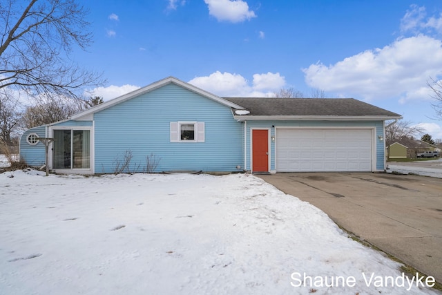 single story home featuring a garage