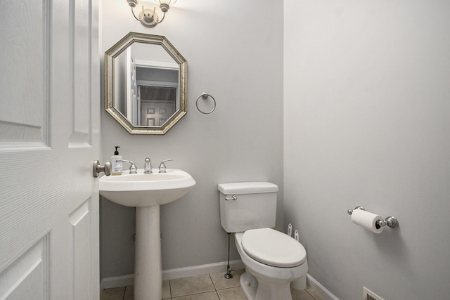 bathroom featuring tile patterned flooring, sink, and toilet