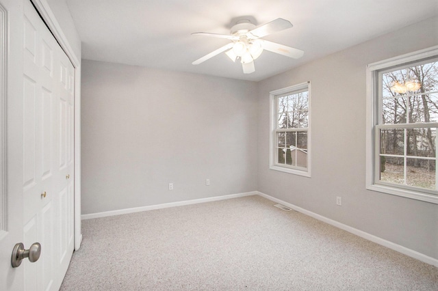 unfurnished bedroom featuring a closet, ceiling fan, and carpet flooring