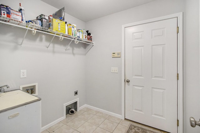 clothes washing area with washer hookup, light tile patterned floors, and hookup for an electric dryer