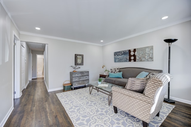 living room featuring dark wood-type flooring and crown molding