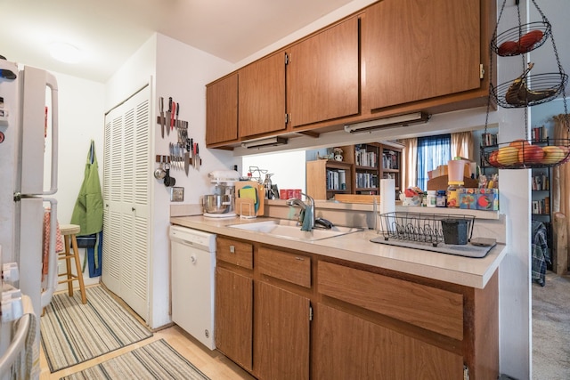 kitchen featuring sink and white appliances