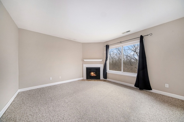 unfurnished living room with carpet floors