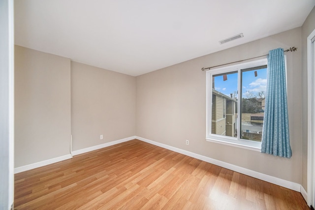 empty room featuring hardwood / wood-style floors