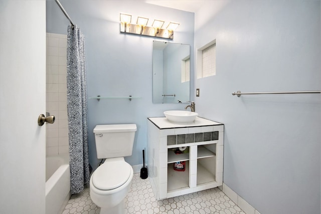 full bathroom with shower / bath combination with curtain, vanity, and toilet