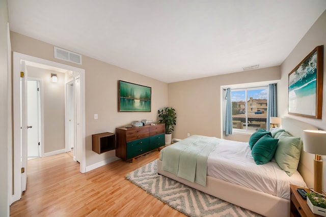 bedroom with light wood-type flooring