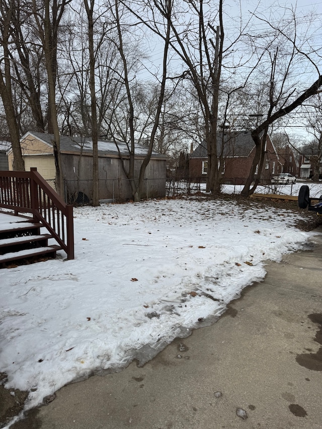 view of yard covered in snow