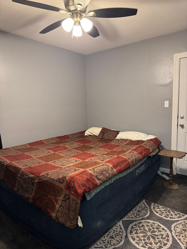 carpeted bedroom featuring ceiling fan