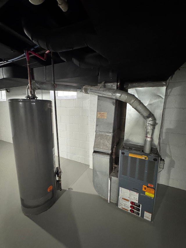 utility room featuring water heater