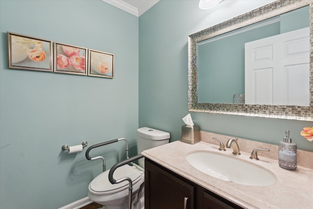 bathroom with vanity, ornamental molding, and toilet