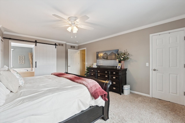 bedroom featuring crown molding, a barn door, and light colored carpet