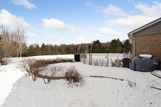 view of yard layered in snow