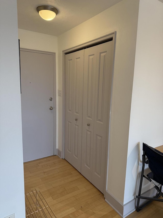 hallway featuring light wood-type flooring