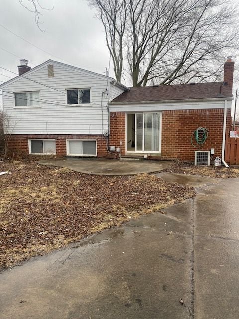 back of property featuring a patio area