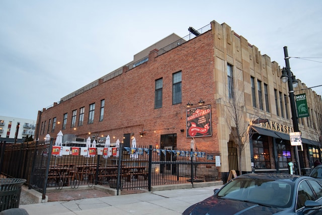 view of building exterior featuring fence