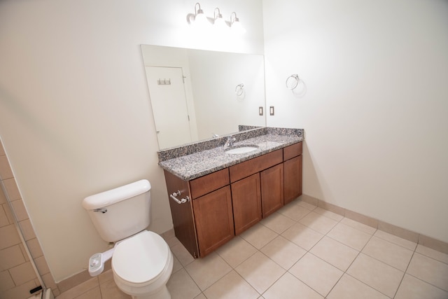 full bathroom featuring toilet, tile patterned flooring, baseboards, and vanity