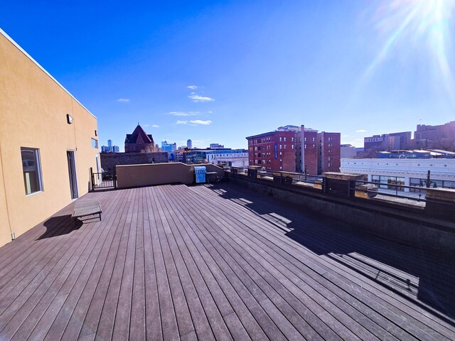 wooden deck with a view of city