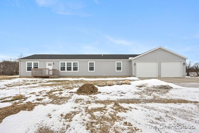 view of front of property with a garage and a wooden deck