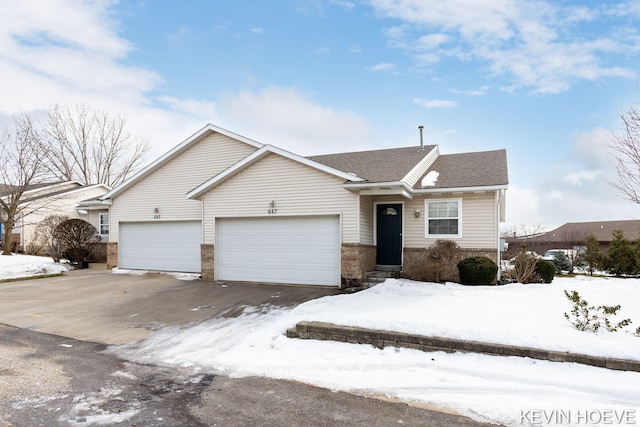 single story home featuring a garage