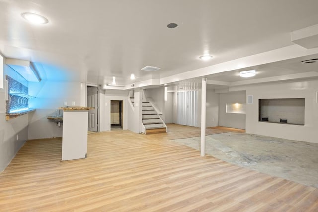 basement featuring light wood-type flooring