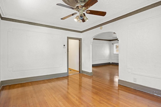 unfurnished room with crown molding, hardwood / wood-style floors, a textured ceiling, and ceiling fan