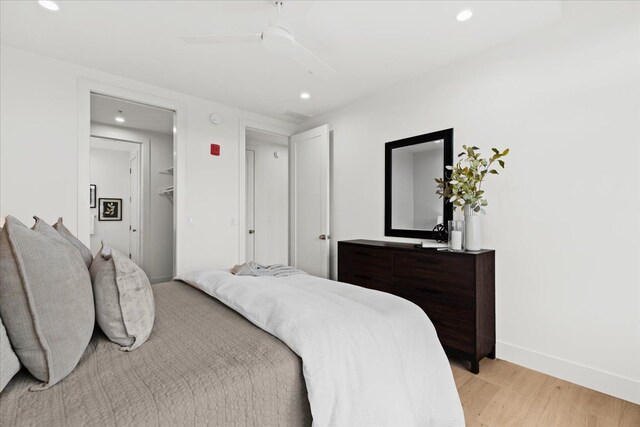 156 N Center St Unit 302, Northville, MI 48167 - bedroom with ceiling fan and light hardwood / wood-style flooring