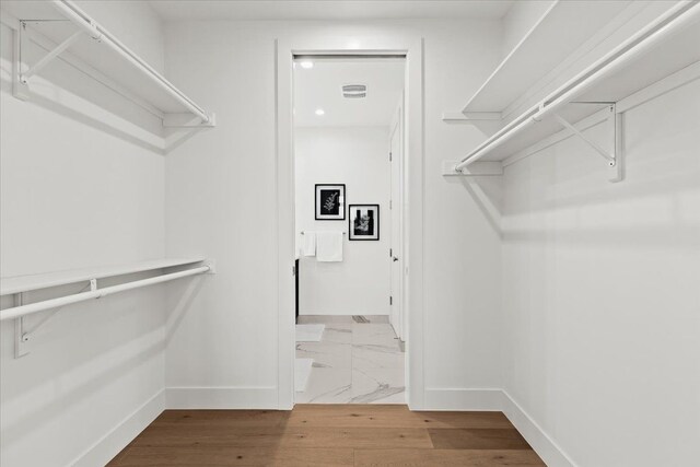 156 N Center St Unit 302, Northville, MI 48167 - walk in closet featuring hardwood / wood-style floors