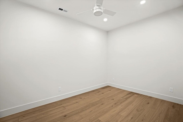 empty room with ceiling fan and light wood-type flooring