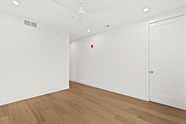 spare room with light hardwood / wood-style flooring and ceiling fan