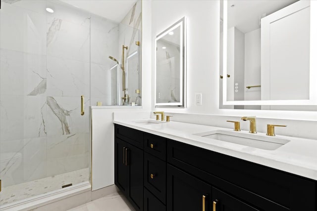 bathroom with vanity and a shower with shower door