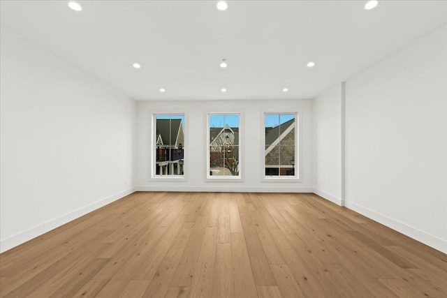 spare room with light hardwood / wood-style floors